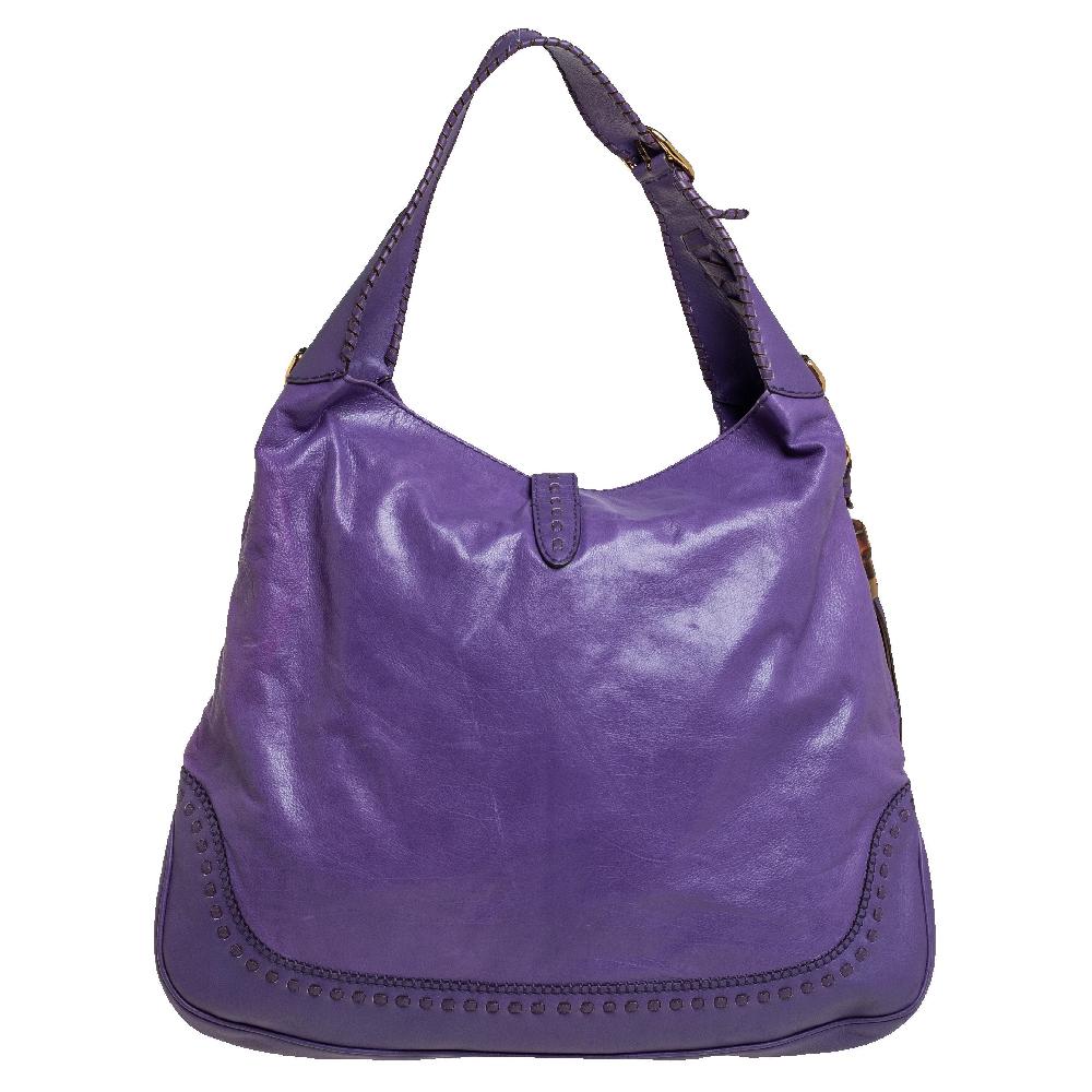Gucci has always offered a bevy of cult-favorite bags, just like this Jackie hobo created as a homage to Jacqueline Kennedy Onassis. It is crafted from leather and flaunts a purple shade. A piston push-lock closure opens to a roomy interior that