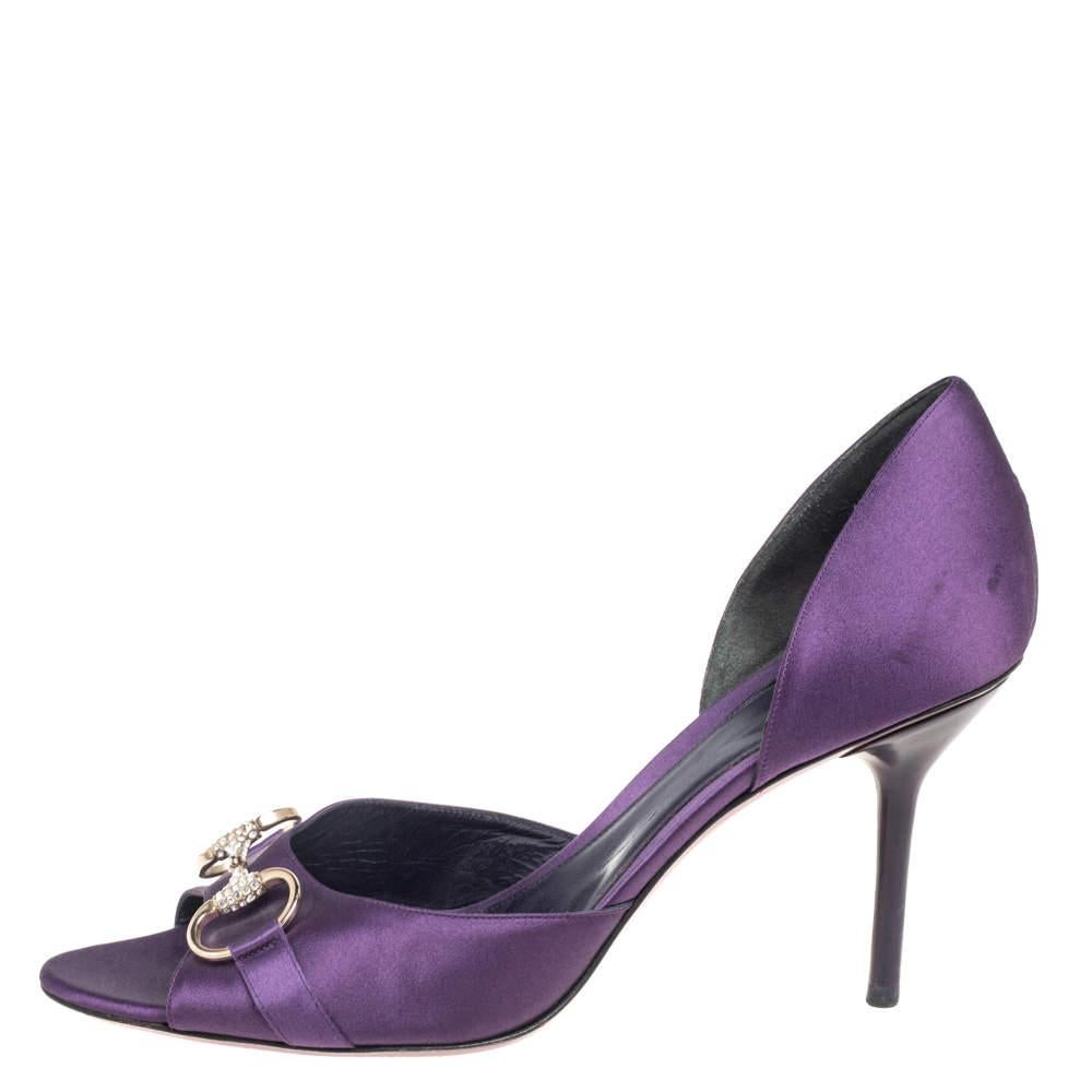 As you walk in these beautiful sandals from the House of Gucci you will certainly attract attention. They are made from purple satin on the exterior and feature a decorative Horsebit motif on the peep-toes. They come with pointed toes and a