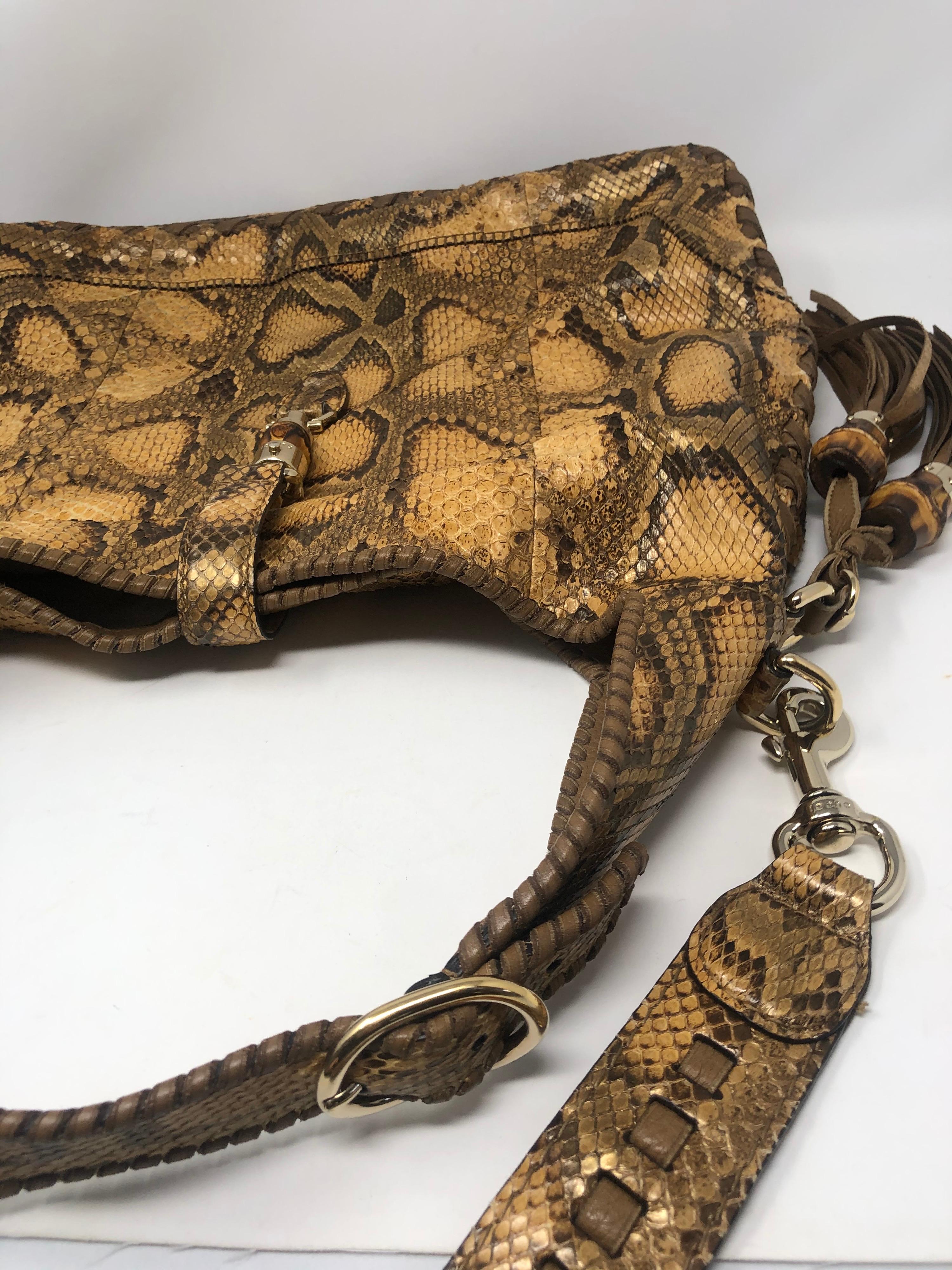 Gucci Python Hobo Bag with bamboo tassel. Excellent condition. Bag has longer strap and can worn without. Braided handle with goldtone hardware. Guaranteed authentic. 