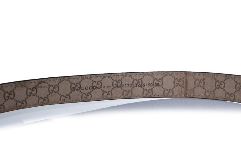 Gucci, python leather belt with gold metal bow For Sale at  display picture 1