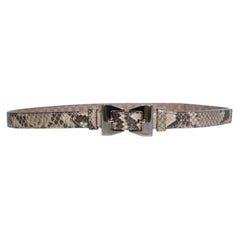 Gucci, python leather belt with gold metal bow