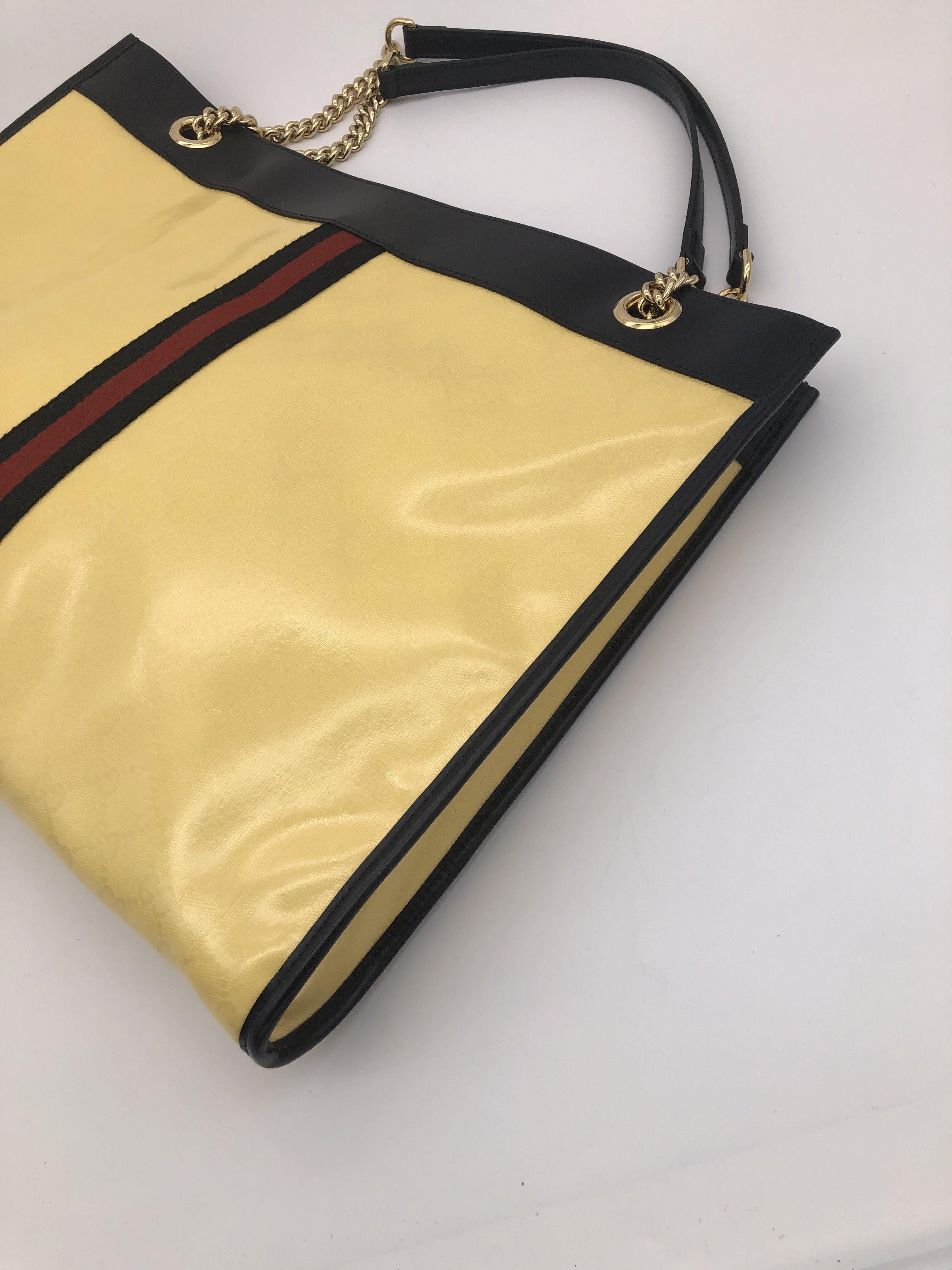 - Designer: GUCCI
- Model: Rajah
- Condition: Never worn. 
- Accessories: Dustbag
- Measurements: Width: 45cm, Height: 35cm, Depth: 4cm
- Exterior Material: Canvas
- Exterior Color: Yellow
- Interior Material: Suede
- Interior Color: Beige
-
