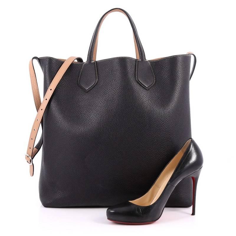 This authentic Gucci Ramble Reversible Tote Leather Large is perfect for everyday casual looks. Crafted in reversible black and nude leather with standout contrast stitching, this simple shopper-style tote features dual slim handles, adjustable