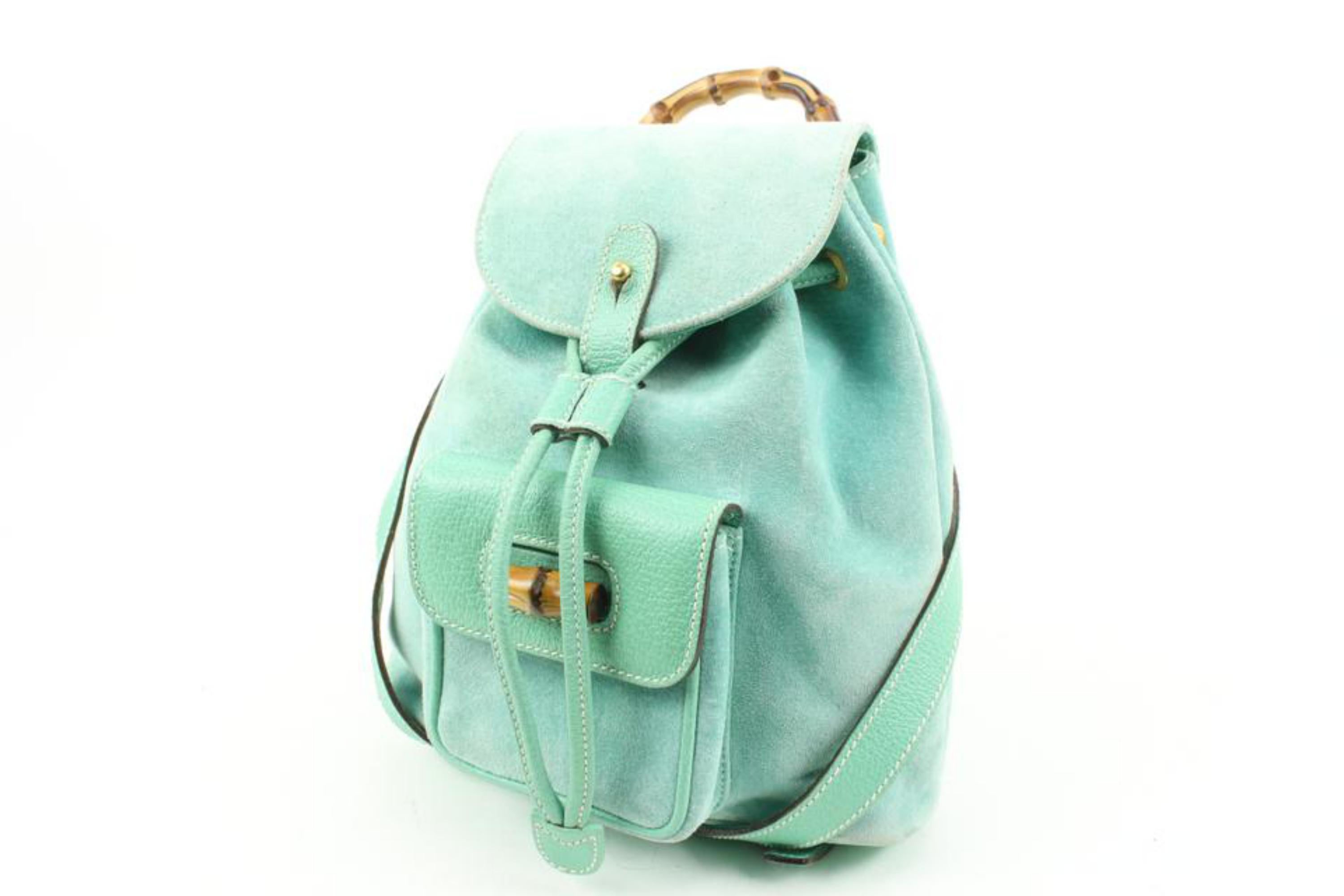 Gucci Rare Mint Green Suede Bamboo Mini Backpack 11g131s
Date Code/Serial Number: 003-2058-0030
Made In: Italy
Measurements: Length:  10