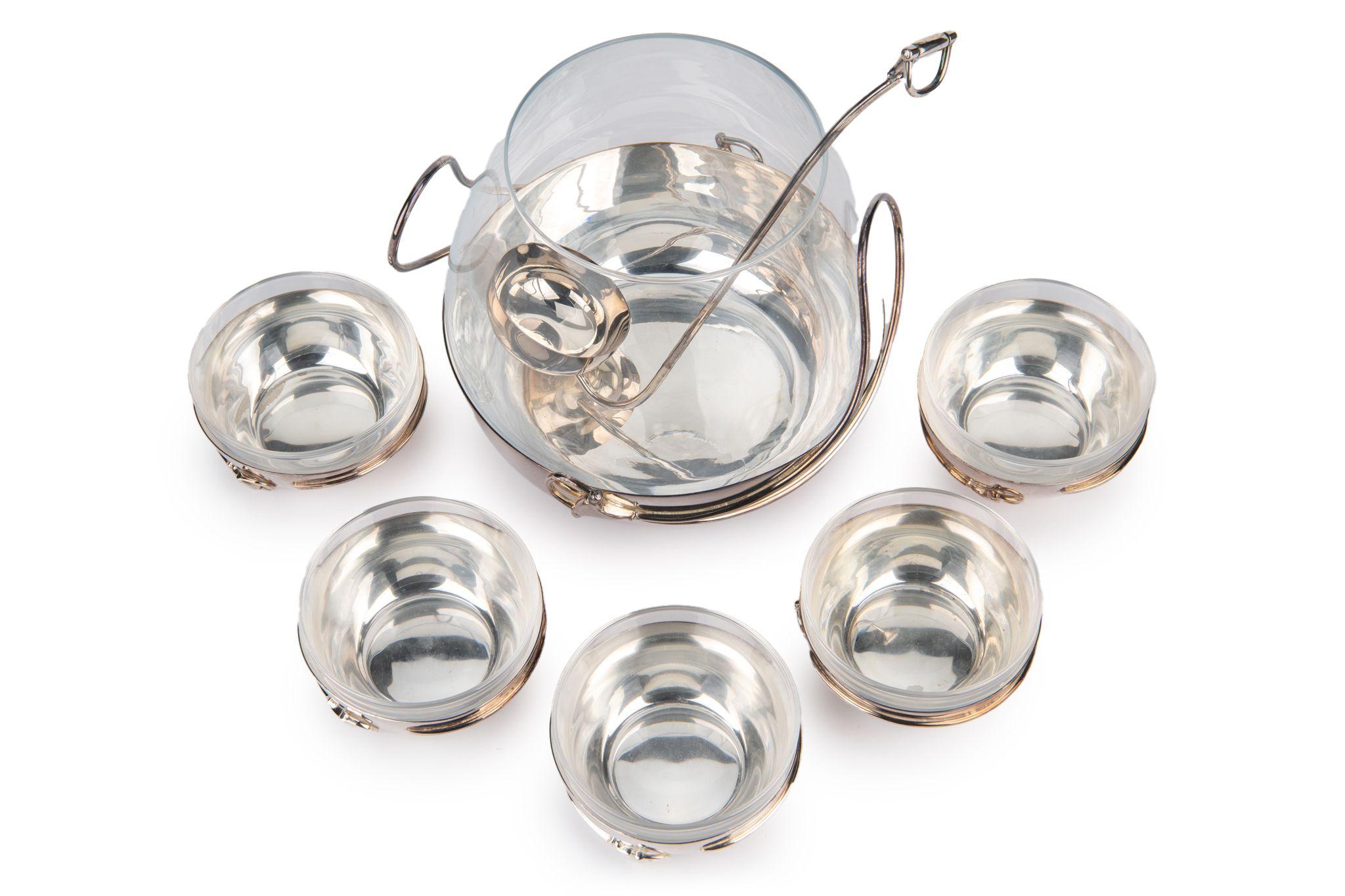 Gucci rare and collectible punch serving set. One large bowl, 5 cups and one ladle . Stirrup design is on all the pieces of the set, showing the signature Gucci design.
The 5 bowls measure 4.25