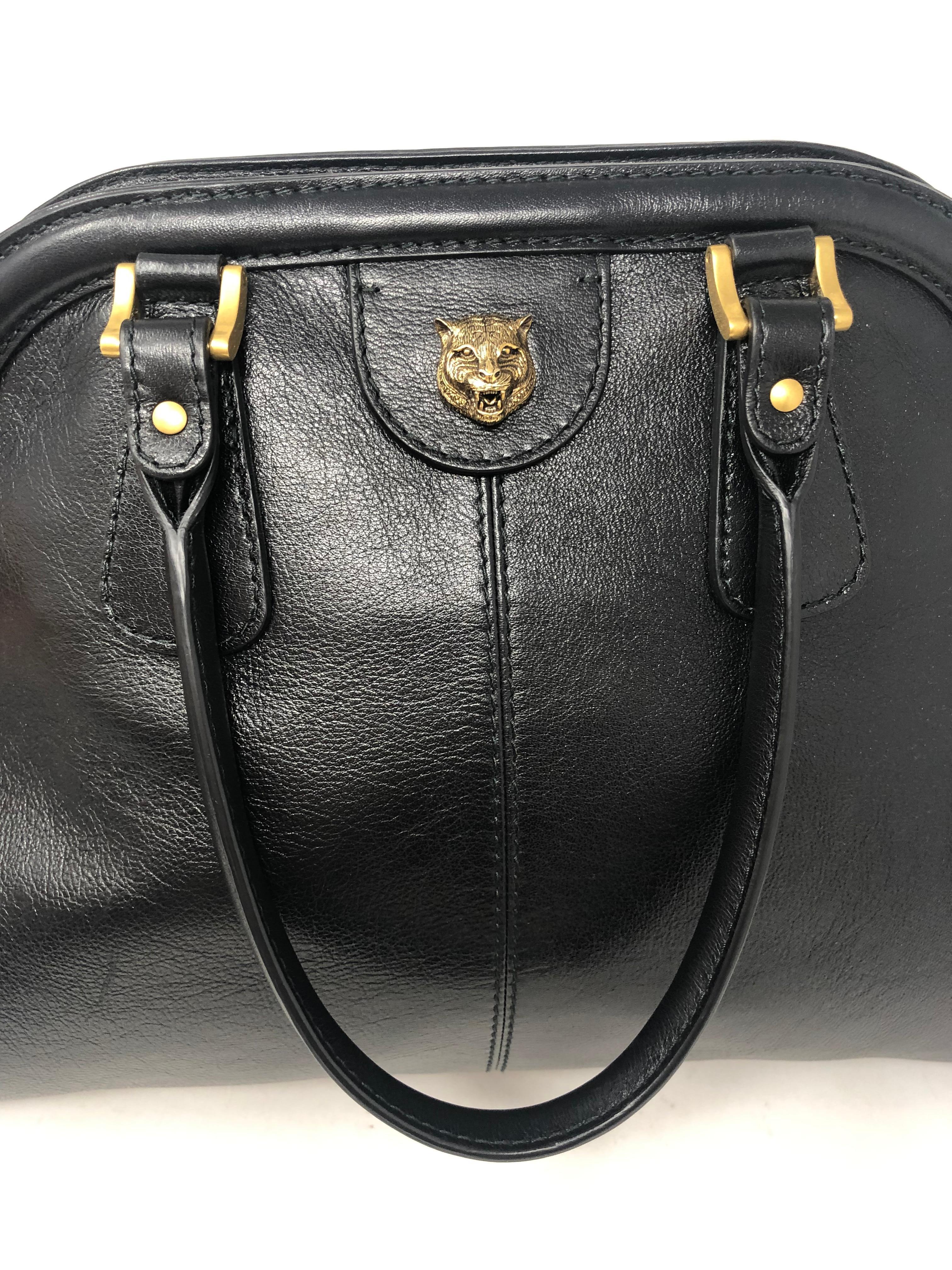Gucci RE(Belle) Large leather top handle bag. Brand new and never used. Smooth leather top handle with antiqued gold hardware. GG logo on one side. Feline head on the other side. 13'