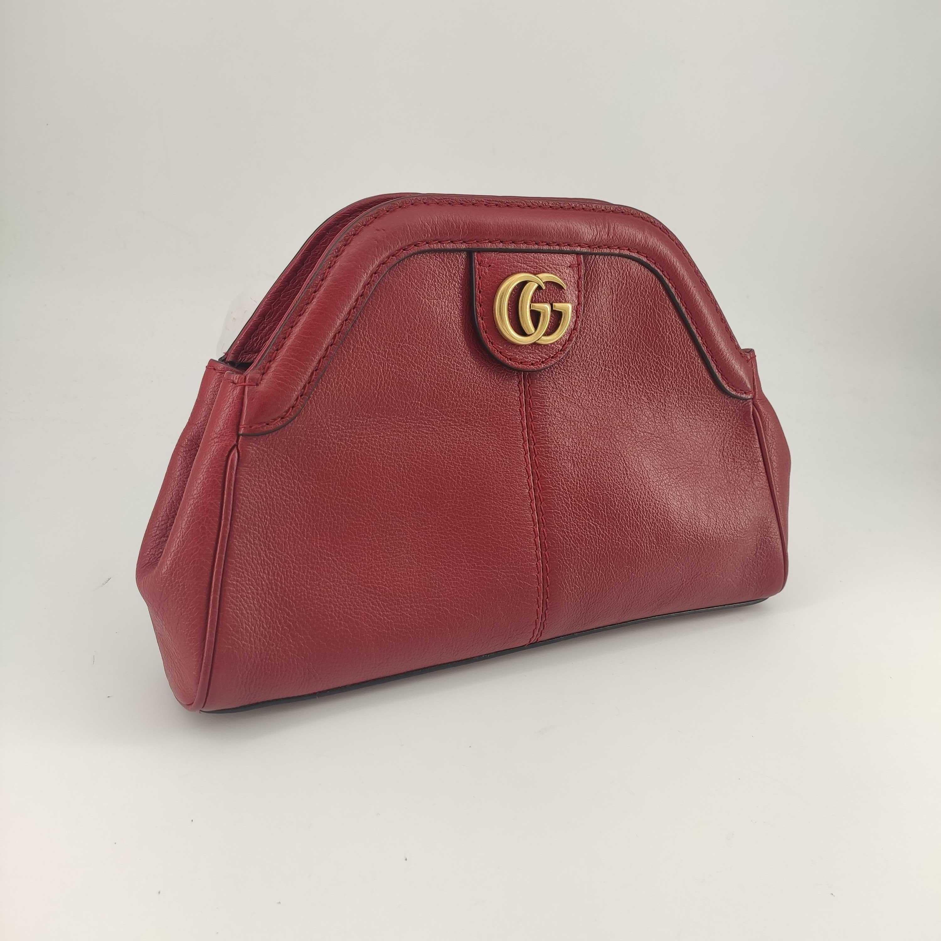 - Designer: GUCCI
- Model: Rebelle
- Condition: Very good condition. 
- Accessories: None
- Measurements: Width: 27cm, Height: 19cm, Depth: 4cm, Strap: 135cm
- Exterior Material: Leather
- Exterior Color: Red
- Interior Material: Suede
- Interior