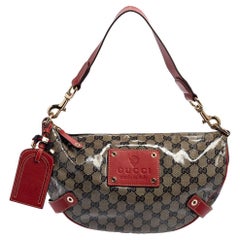 Rot/Beige GG Kristall Segeltuch und Leder Voyager Hobo von Gucci