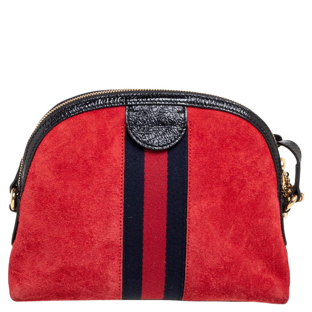 Stacked with signatory elements of the House, this Ophidia crossbody bag from Gucci will bring iconic excellence to your style. It is made from suede and leather, with gold-toned GG motifs perched on the front. A Web Stripe trim outlines the center