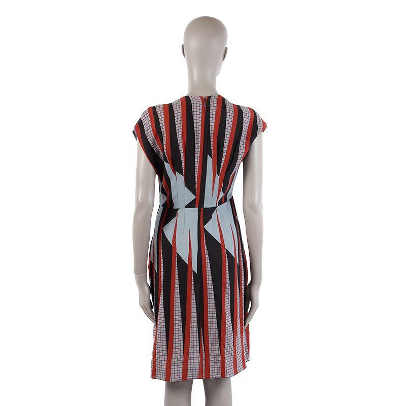 Gucci graphic print empire-waist dress in black, dusty blue, and dark red silk (100%). With cap sleeves, V-neck, and pleated skirt. Closes with invisible back zipper. Unlined. Has been worn and is in excellent condition.

Tag Size 42
Size M
Shoulder