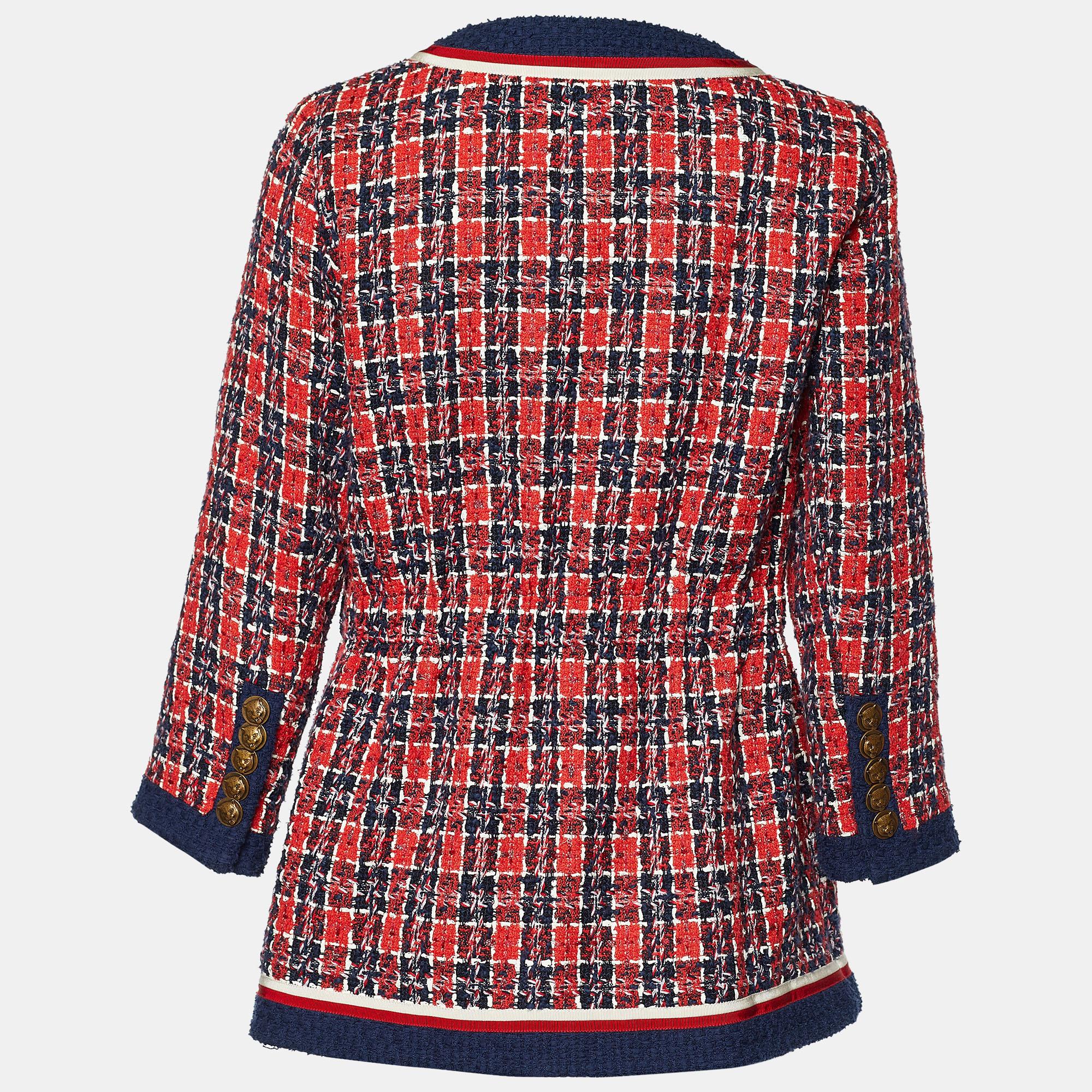 Let your luxury collection experience Gucci's one-of-a-kind, signatory aesthetic with this stunning jacket. Made from red-blue tweed fabric, this jacket is augmented with gold-tone buttoned closures. It displays long sleeves and four pockets on the