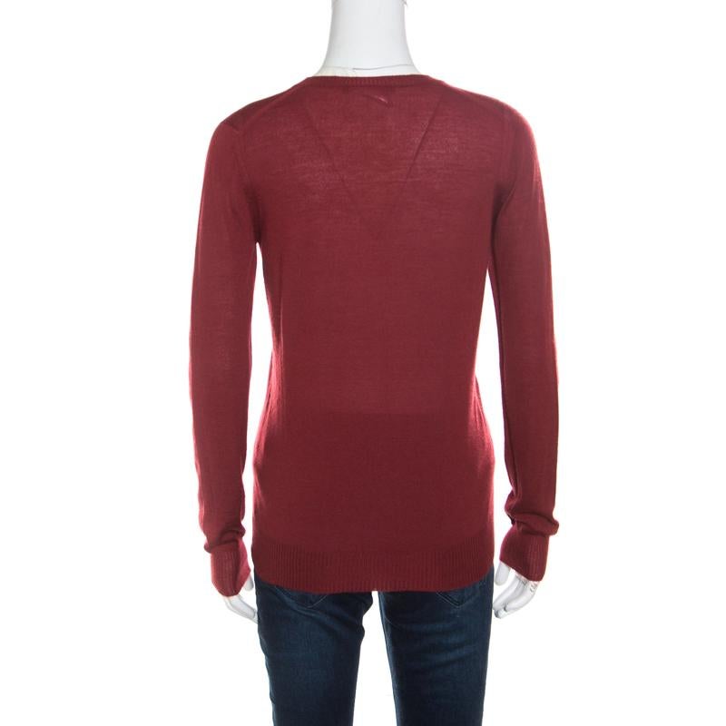 The lovely red hue and the fine silhouette combine to make this Gucci sweater a loved style that can be flaunted with a lot of variety. It is crafted with luscious cashmere which ensures you comfortable wear and luxe appeal. It is complete with