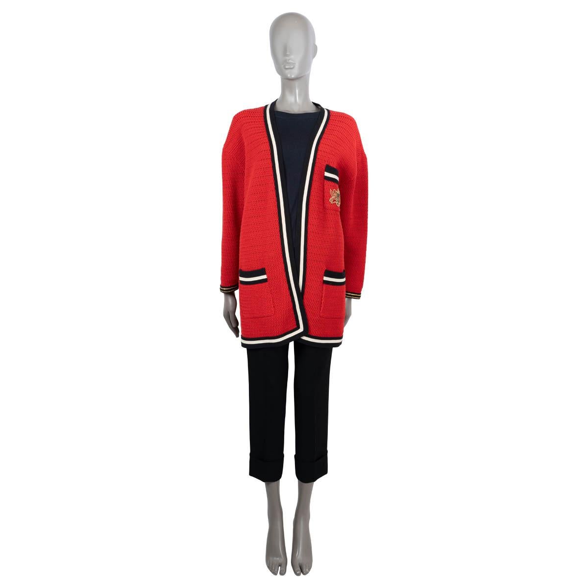 100% authentic Gucci crochet knit jacket in red cotton (55%) and polyamide (45%). Features a crest patch on the chest pocket, two patch pockets at the waist and contrast trims. Unlined. Has been worn with minor stains inside on the shoulders.