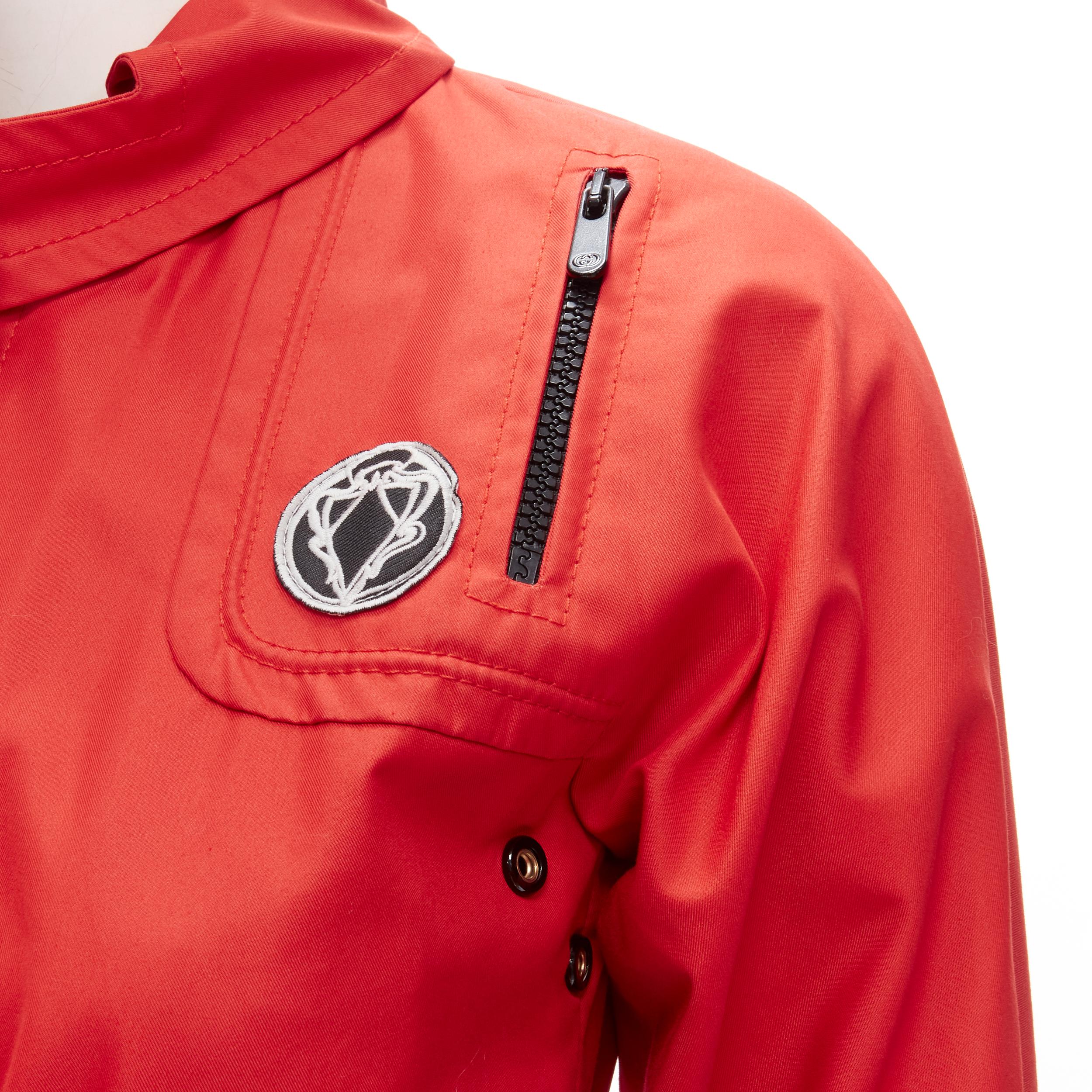 GUCCI red cotton elasticised waist belted anorak parka jacket IT36 S
Brand: Gucci
Material: Feels like cotton
Color: Red
Pattern: Solid
Closure: Zip
Extra Detail: Gucci Vintage Crest badge at chest. GG logo black zipper pull. Elasticised waist with