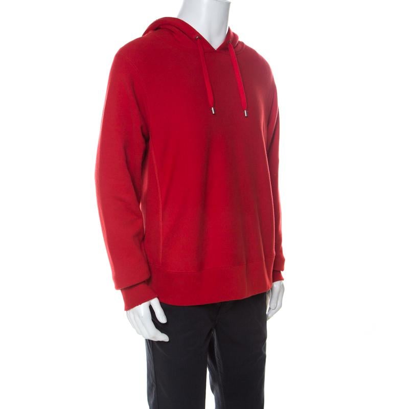 Essay effortless style with this red hoodie from Gucci. The hoodie is made of quality cotton and it features long sleeves and a hood with drawstring. The design is elevated by a dragon embroidered on the back. This creation is perfect to keep you