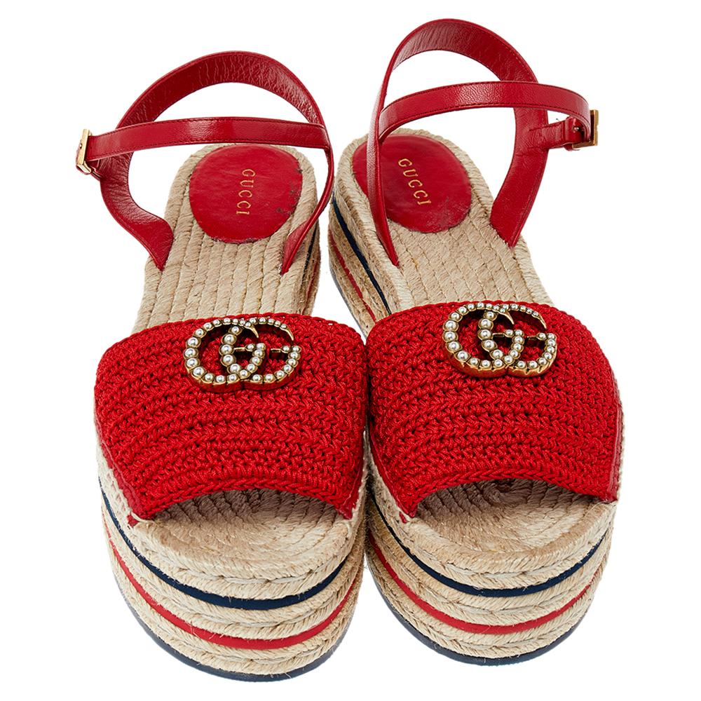 These stunning sandals are designed to elevate your look instantly. They are crafted from red crochet fabric & leather and feature a round toe silhouette. The platforms and heels feature trendy espadrille detailing and the vamps are decked with
