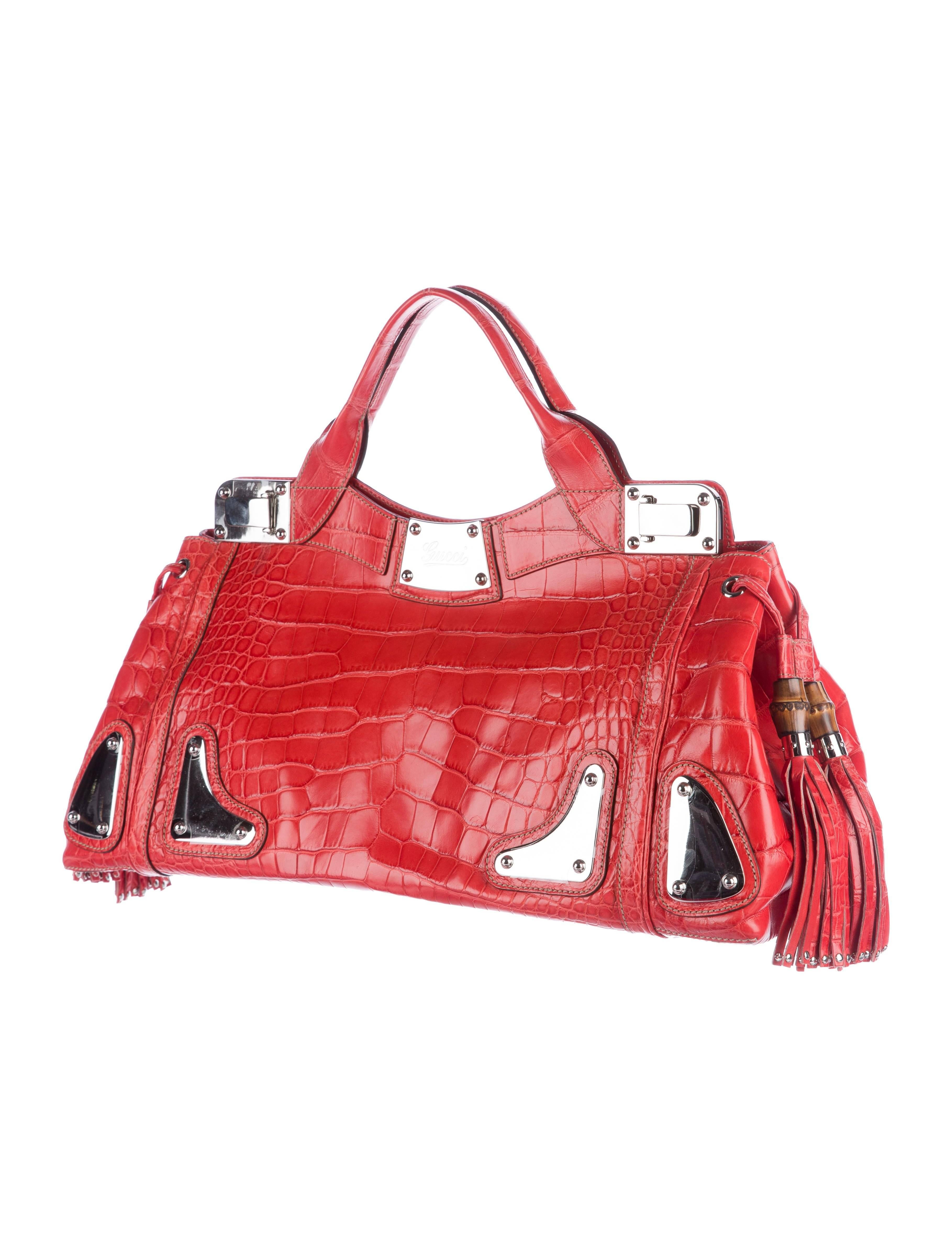 Gucci Red Black Crocodile Exotic Skin Leather Evening Top Handle Satchel Bag in Box

Original purchase price $29,995
Crocodile 
Bamboo
Silver tone hardware
Leather lining,
Flip lock closure
Made in Italy
Handle 5.5