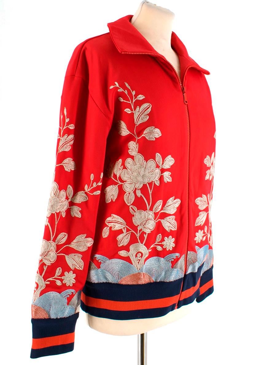 Gucci Red floral embroidered track jacket 

- floral embroidery - elasticated ribbed hem and waist - zip fastening 

Please note, these items are pre-owned and may show signs of being stored even when unworn and unused. This is reflected within the