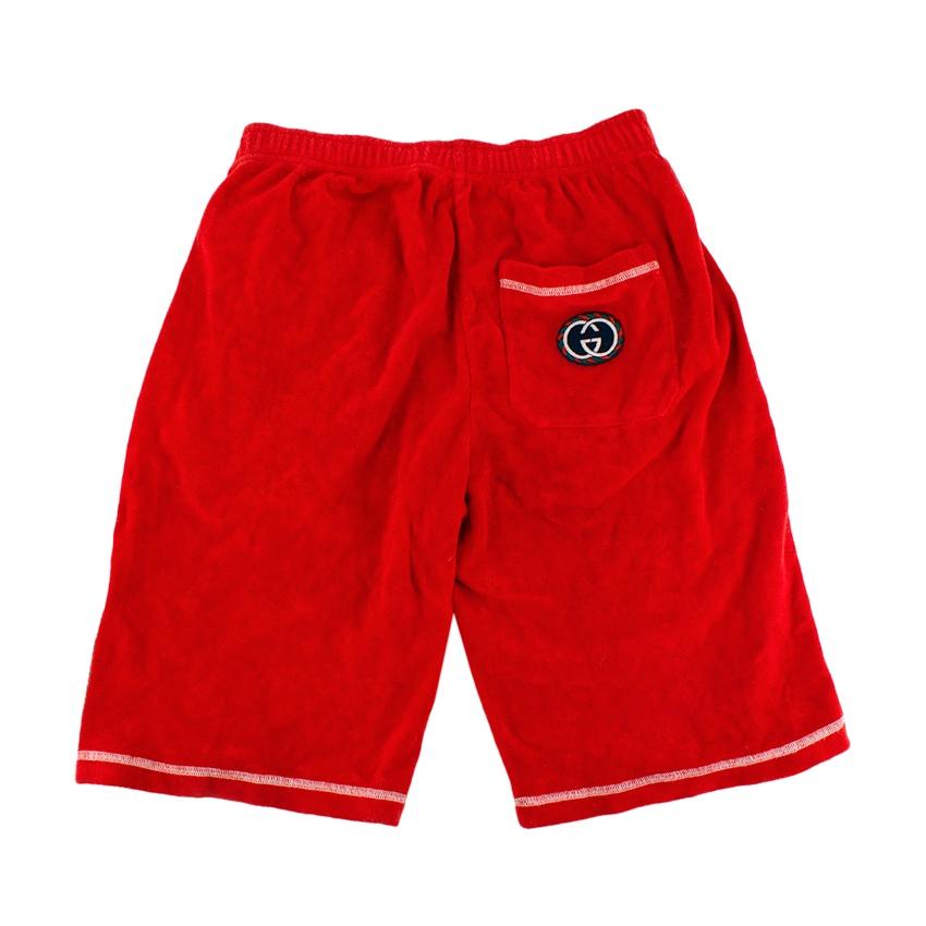 Gucci Red French Terry Basketball Shorts 
 

 - Gucci longline basketball style shorts in red french terry cloth with green accents
 - Elasticated waistline
 - White stitched hems
 - GG logo back patch pocket
 

 Materials 
 100% Cotton
 Trim 
 63%