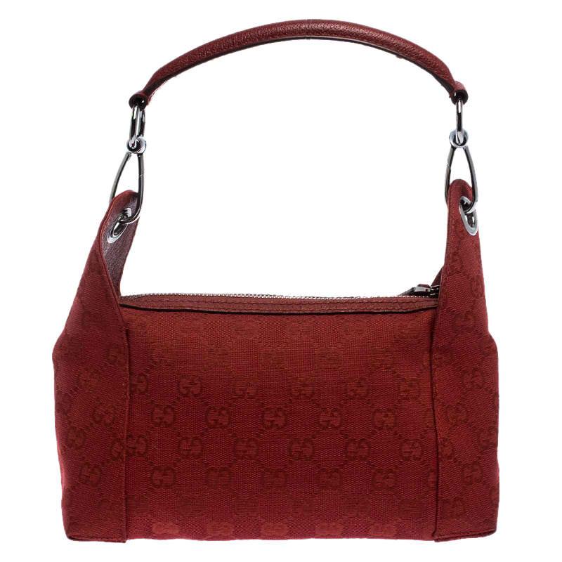 Get this stunning bag by Gucci now. Crafted from the brand's signature GG canvas and leather it comes in a striking shade of red. It is held by a single shoulder strap, has a top-zip closure that opens to a fabric-lined interior with a zip pocket