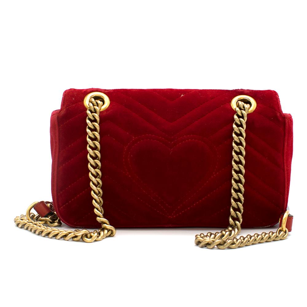 Gucci Red GG Marmont Mini Velvet Bag

- Signature GG logo on 
- Antique gold-toned hardware
- Interior zipper pocket
- Sliding chain can be used on shoulder or as a crossbody 
- Flap with spring closure 
- Turquoise lining 

Please note, these items