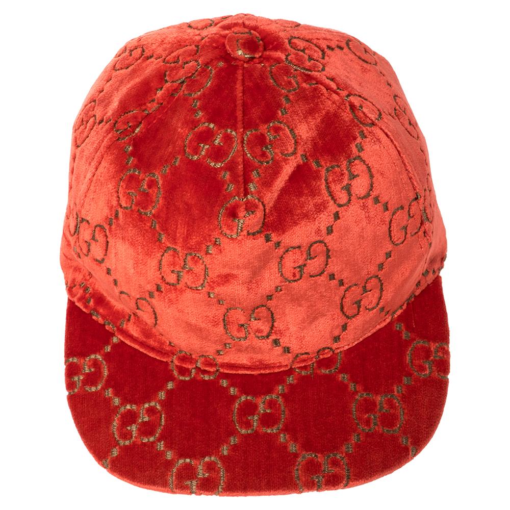Elevate your casual style with this red baseball cap from Gucci. It is designed with velvet in a luxe style and has the GG logo spread all over. An adjustable strap completes the cap. Add this creation to your streetwear look!

Includes:Original