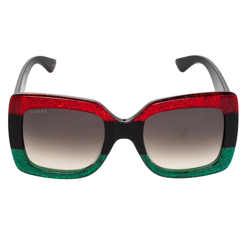 These Gucci square sunglasses will add a luxe element to your summer look. The pair comes in a sturdy frame featuring red and green shades that resemble the signature Web stripes and are fitted with protective lenses. Skilfully made, this pair is