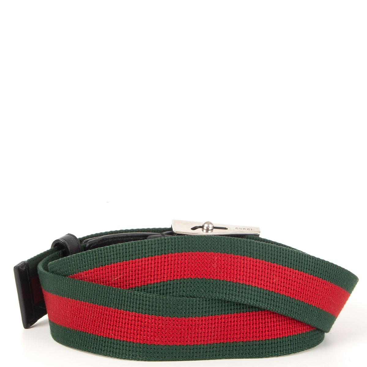 Gucci 'L'aveugle Par Amour' buckle Web belt in green and red with black leather trim. Has been worn and is in excellent condition. 

Tag Size 95
Width 3.5cm (1.4in)
Length 111cm (43.3in)
Buckle Size Height 4cm (1.6in)