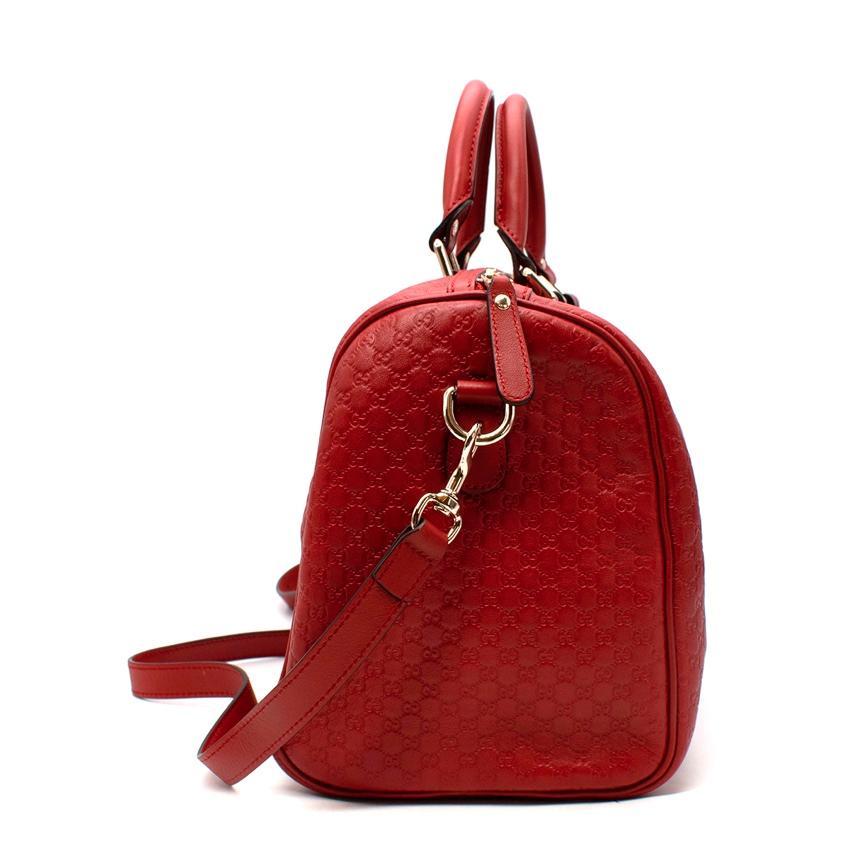 Gucci Red Guccissima Leather Boston Bag
 

 - Embossed Guccissima leather
 - Two top handles
 - Removable & adjustable body strap 
 - Silver-tone hardware 
 - Capacious fabric lined interior
 

 Materials:
 Leather
 

 Made in Italy
 

 PLEASE NOTE,