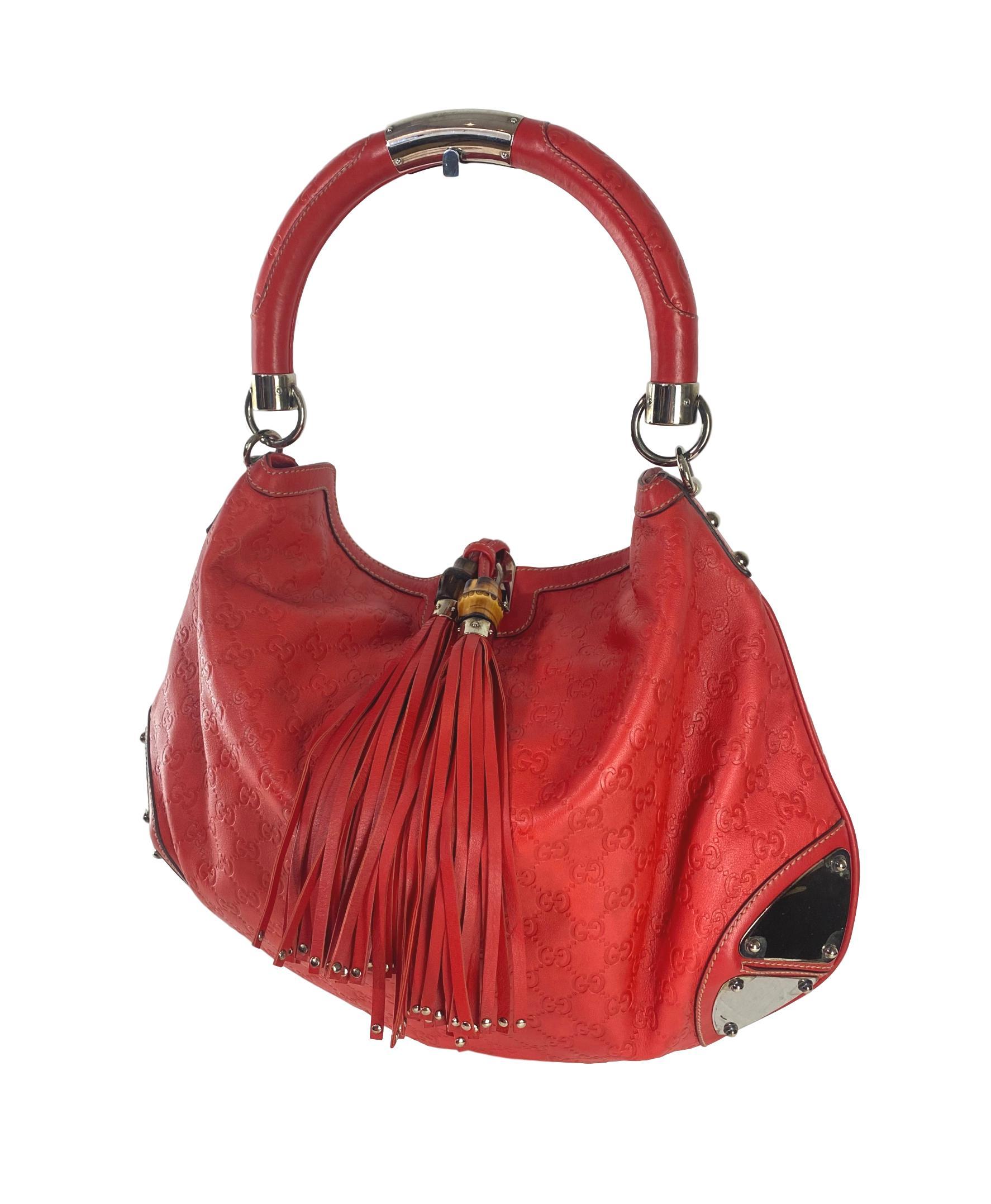 Gucci Red Guccissima Leather Large Babouska Indy Hobo, Italy 2008. This rare and limited edition bag is handcrafted from red dyed Guccissima leather in the classic monogram 