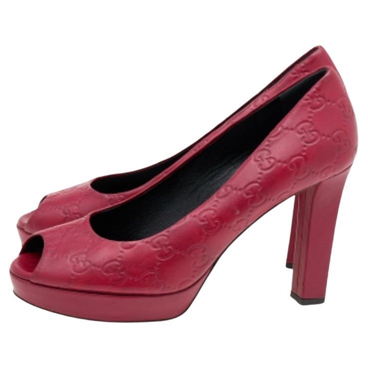 Stacked with iconic House elements and aesthetics, these pumps from the House of Gucci bring unending charm and beauty to your style. They are crafted from red Guccissima leather and exhibit peep-toes, platforms, and block heels. Add a dash of red