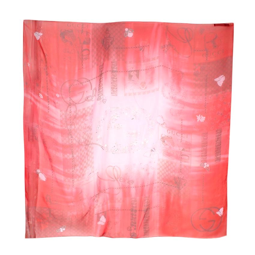 Gucci Red House Staples Print Shawl

- Made of luxurious lightweight silk 
- Sheer 
- House staples print, depicting the house signature elements such as the GG monogram, GG logo, bamboo and the bee amongst others
- Timeless elegant design