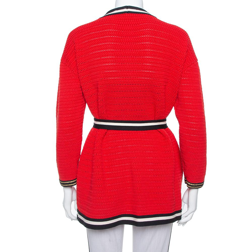 This cardigan from Gucci is so stylish, you'll find reasons to wear it! The red cardigan is made of a quality cotton blend and features a relaxed silhouette. It flaunts contrasting trims, a belt detail on the waist, front pockets, and long sleeves.