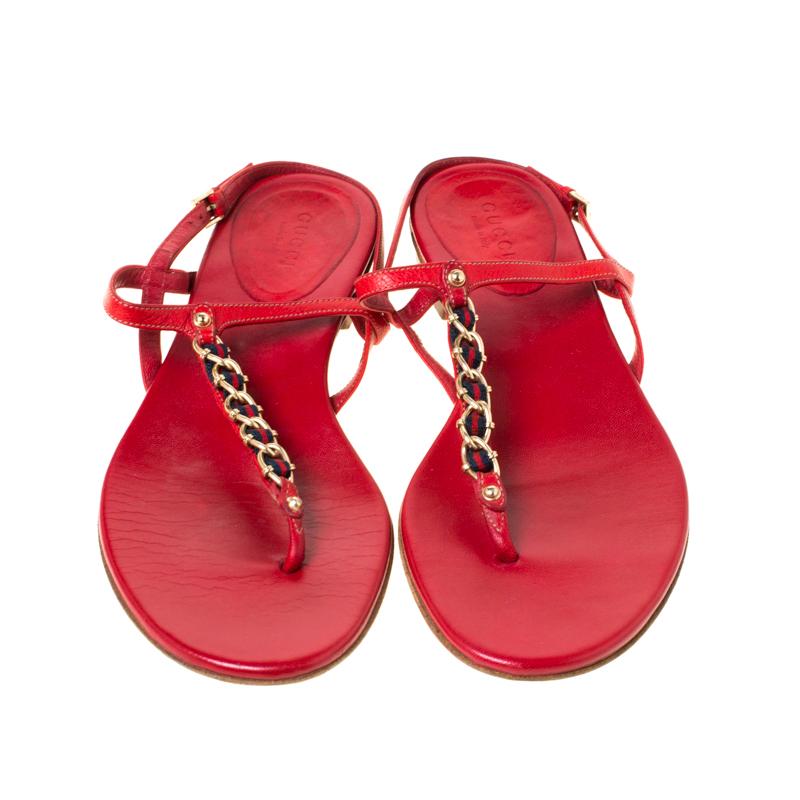 This pair from the house of Gucci makes for a very chic addition to your outfit. These leather sandals are a high-end fashion item that you need to own now. The thong sandals have a chain strap along with the web detail on the front and an