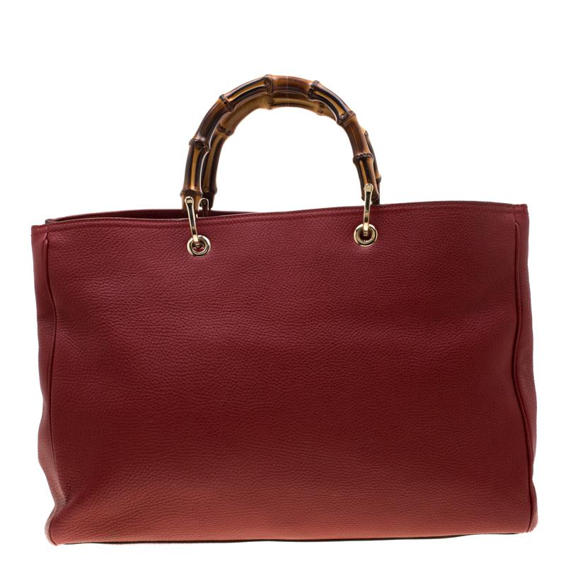 The ever-classic shopper tote is crafted from durable red leather. Lined with canvas, this bamboo handle bag will easily last season after season. If you're looking for a stylish accessory, you cannot go wrong with this one from Gucci. Be remarkable