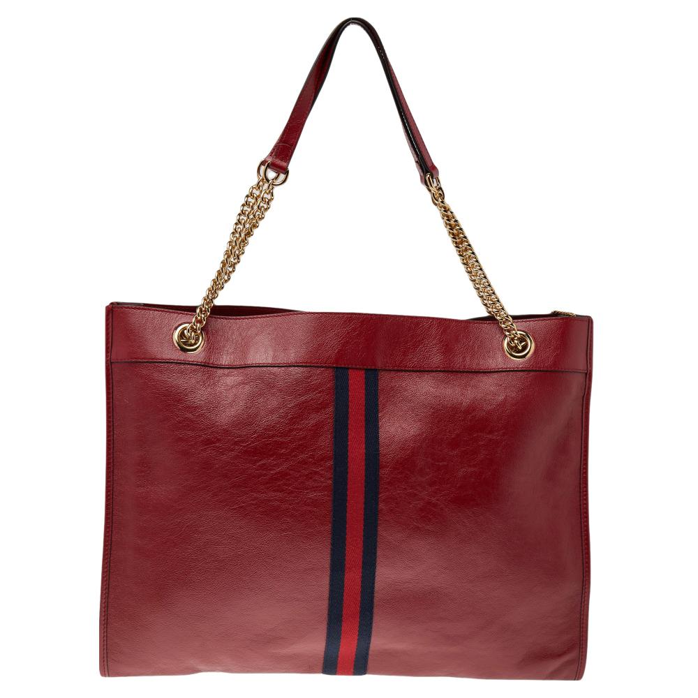 Channel your love for luxurious styles with this leather bag. The well-sized suede interior and the dual shoulder handles make this bag functional. This Rajah tote by Gucci has been designed to assist you with utmost ease on all days. It is finished
