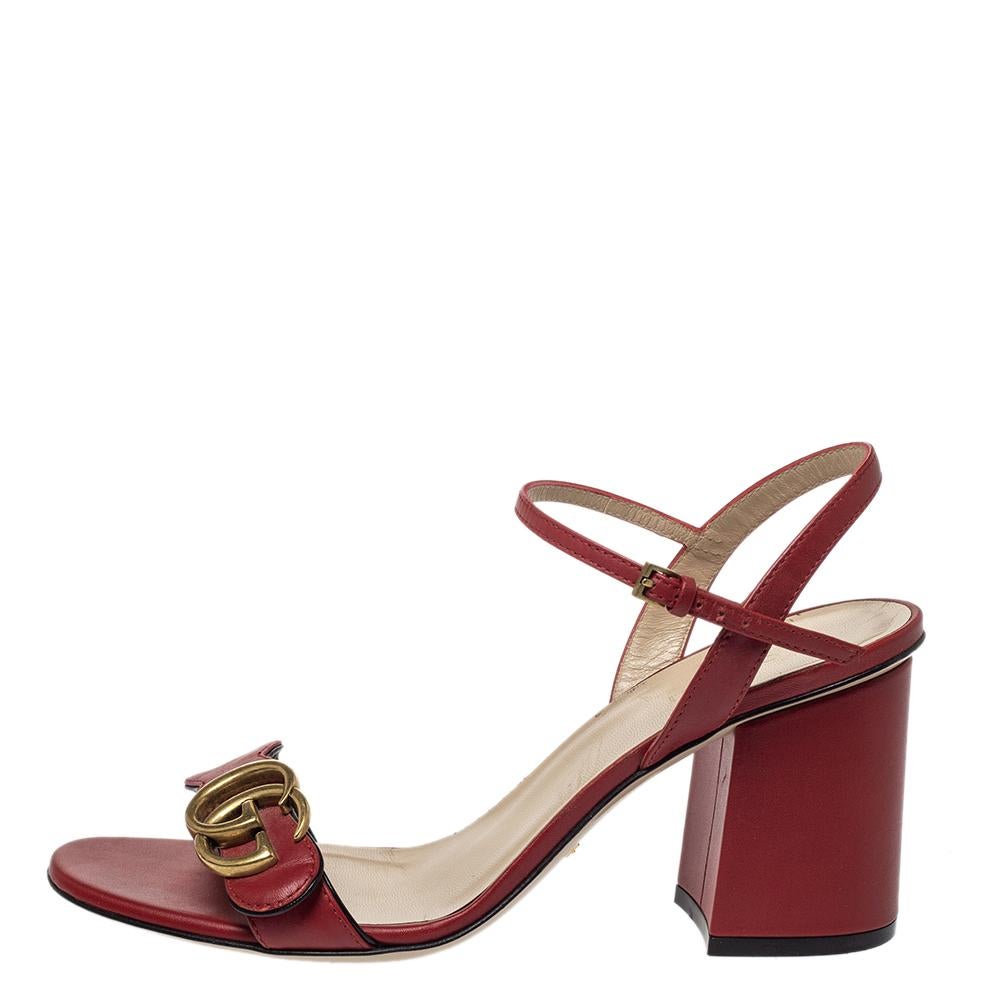 Exuding beauty in true luxury style are these sandals from the house of Gucci! They've been crafted from leather and designed with buckle ankle straps, block heels, and the signature GG on the wavy upper straps. You can wear them with your casual