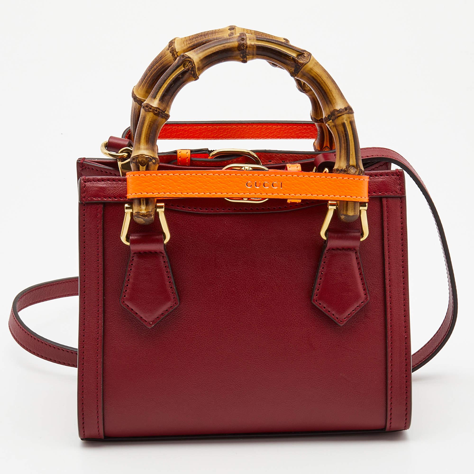 You are going to love owning this mini Diana tote from Gucci as it is well-made and brimming with luxury. The Diana tote has been crafted from leather and lined with Alcantara on the insides. It has a red hue and two bamboo handles along with a