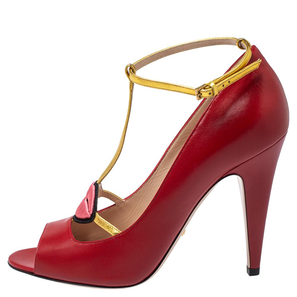 How can one not fall in love with these sandals by Gucci! They've been beautifully crafted from striking red-hued leather and styled with playful embroidered lips on the uppers. The sandals carry peep toes, gold t-strap forming the ankle fastenings,