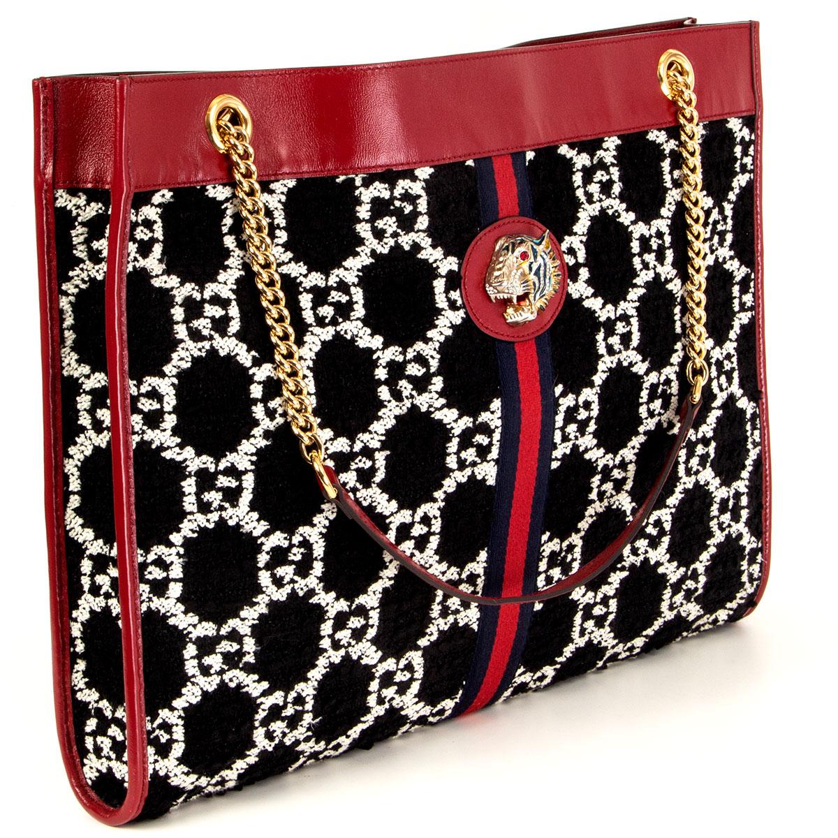 100% authentic Gucci Rajah Large tote bag in black and white GG Jacquard tweed, trimmed with cerise leather and the House Web in red and navy. The line is defined by the tiger head finished with coloured enamel and sparkling crystals, inspired by a