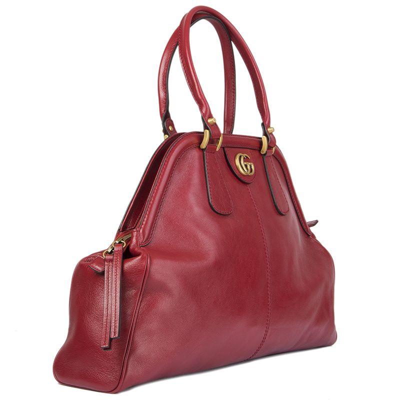 Gucci 'Re (Belle) Small' shoulder bag in red supple natural grain leather with a washed and brushed finish. Opens with a double zipper on top and is lined in light pink microfibre with one zipper pocket against back and one against the front. The GG