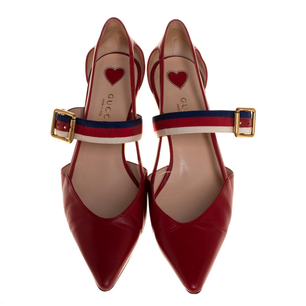 These pointed-toe pumps from Gucci have come straight from a shoe lover's dream. Crafted from red leather, detailed with web straps, and balanced on 5.5 cm bamboo heels, the pumps are lovely and gorgeous!

Includes: Original Dustbag
