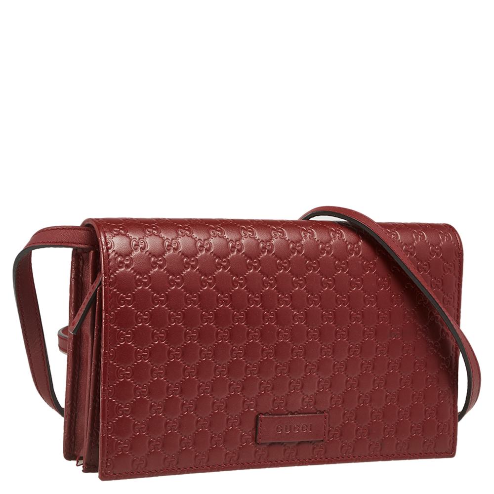 The Gucci bag is designed to be a reliable style companion. It is crafted from Microguccissima leather in a red shade and features a label-detailed front flap that opens to a well-sized interior. The bag is finished off with a slender leather