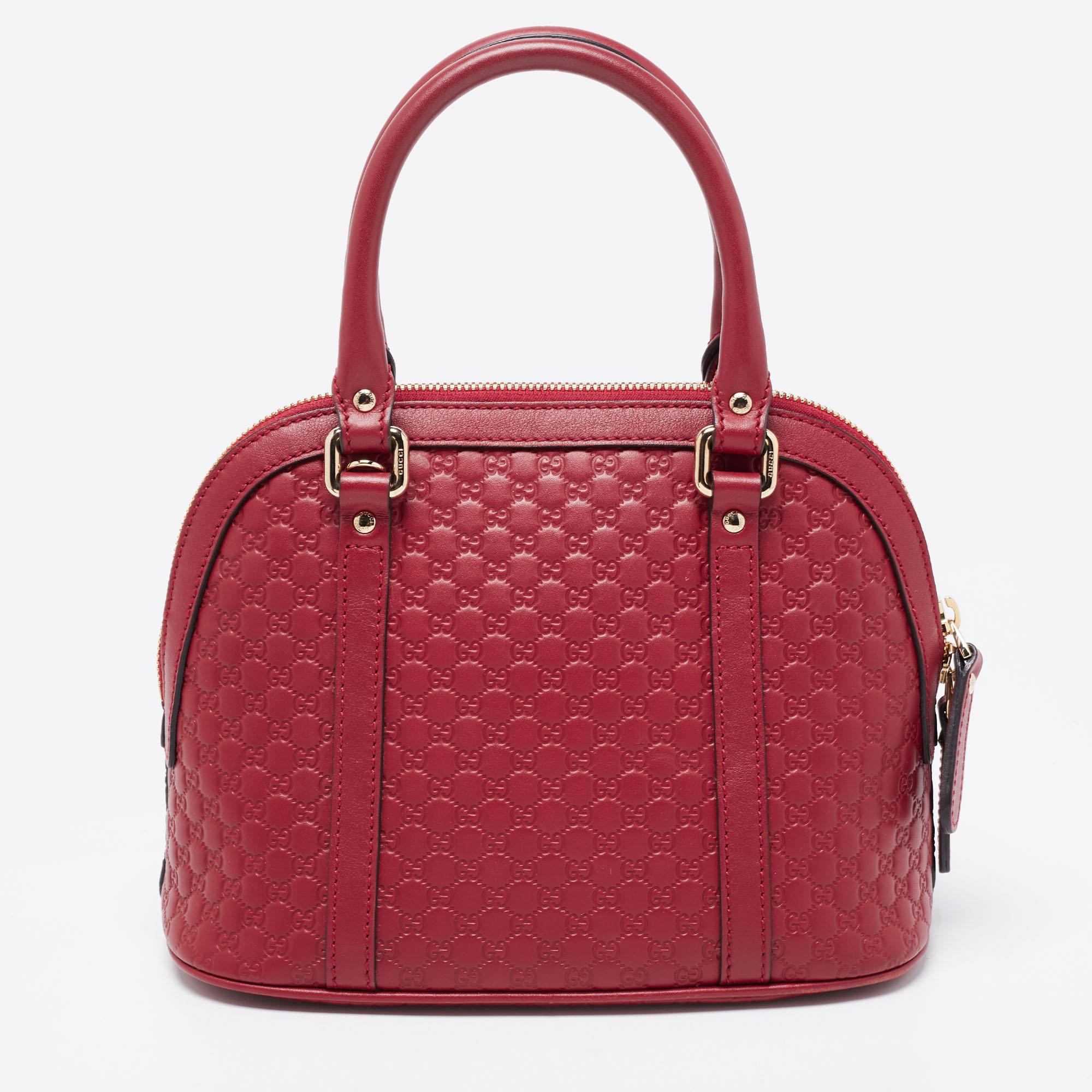 This Gucci bag is designed to offer function and style at the same time. It is made of Microguccissima leather and decorated with gold-tone hardware for an elegant look. The bag is held by dual top handles and a detachable strap.

Includes: Info