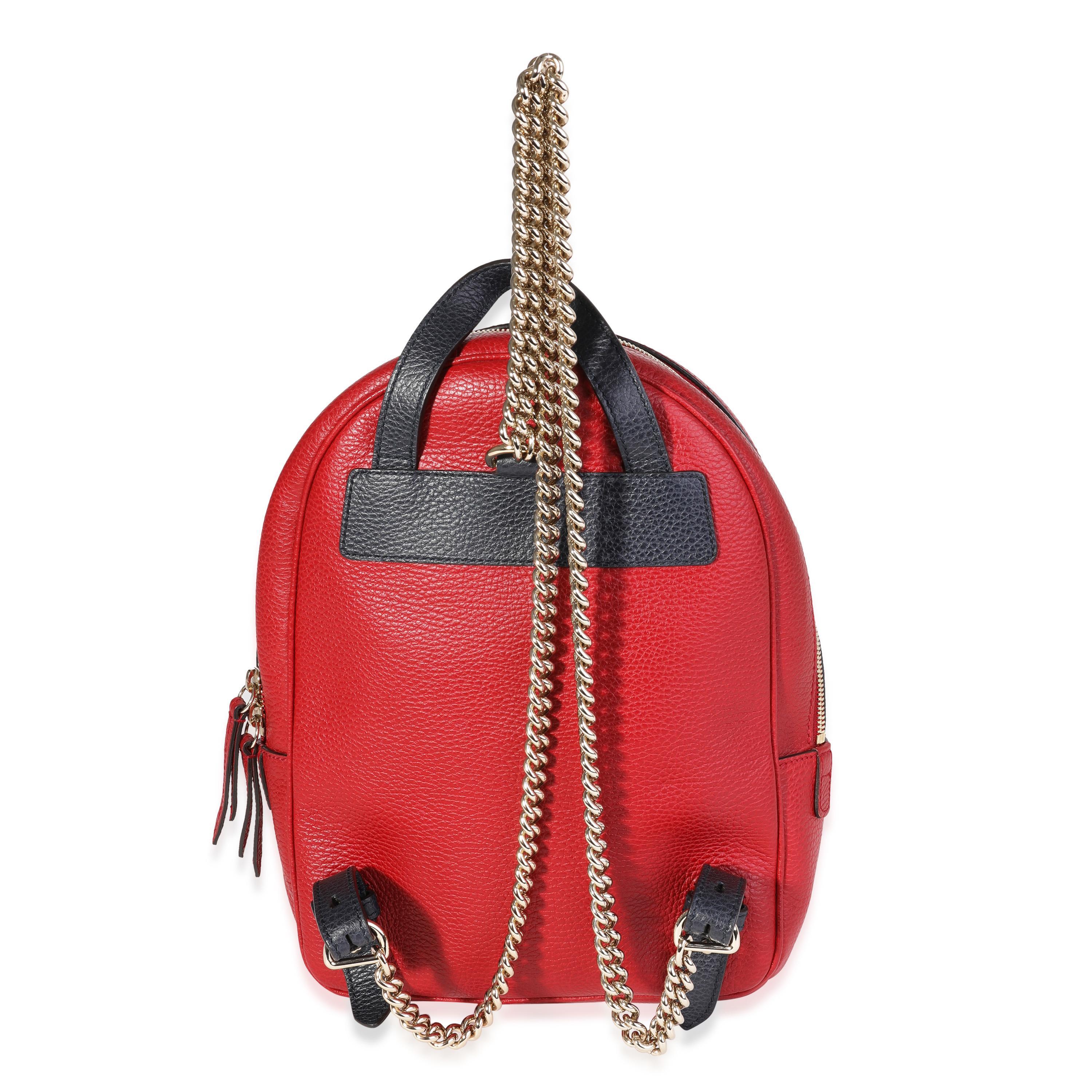 Listing Title: Gucci Red & Navy Pebbled Leather Soho Chain Backpack
SKU: 120373
MSRP: 1790.00 USD
Condition: Pre-owned 
Condition Description: Gucci's classic GG monogram is made from sturdy canvas in a beige and brown color combination - a House