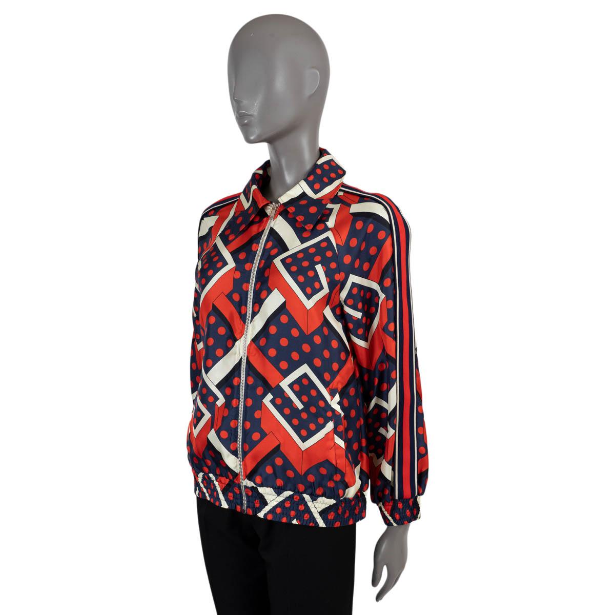 100% authentic Gucci G Dot Labyrinth print jacket in red, navy blue and white silk (100%). Features a pointed collar, web stripe down the sleeves, elastic cuffs and two slant pockets. Has been worn and is in excellent condition.

2021