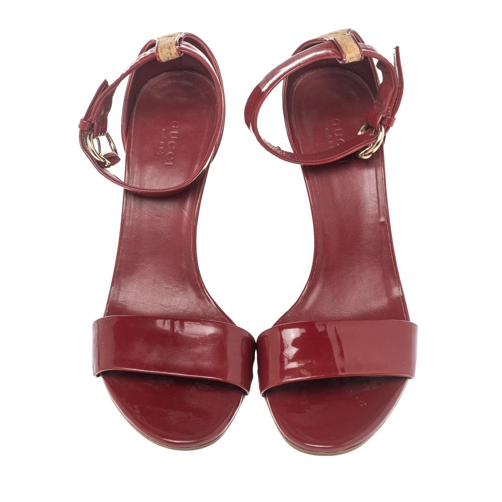 Created with contemporary design aesthetics, these stunning Gucci sandals are sure to be a worthy investment! They come finely crafted from red patent leather and feature an open-toe silhouette. They flaunt buckled ankle straps along with