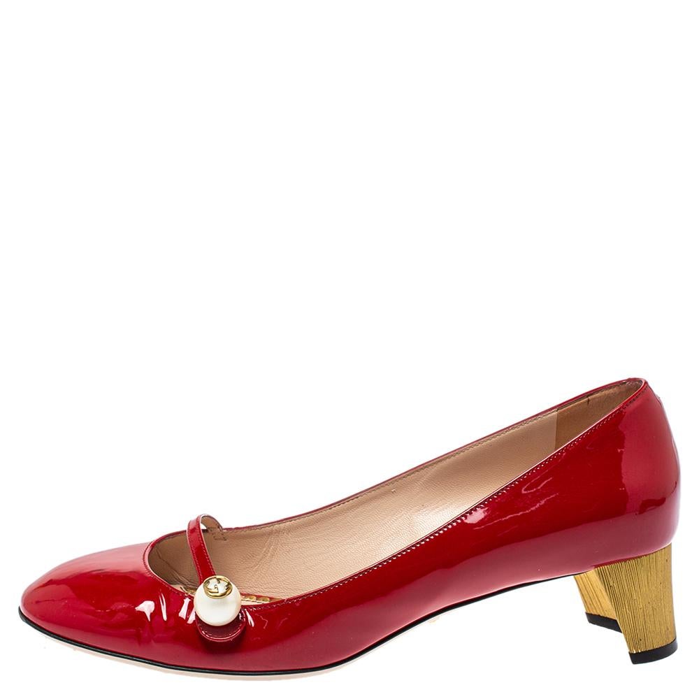 These Gucci pumps come in a mary jane silhouette and are as feminine and stylish as they can get— thanks to the logo-accented pearl button closure and gold-tone curved heels. With round toes, glossy patent leather construction, and a red shade,