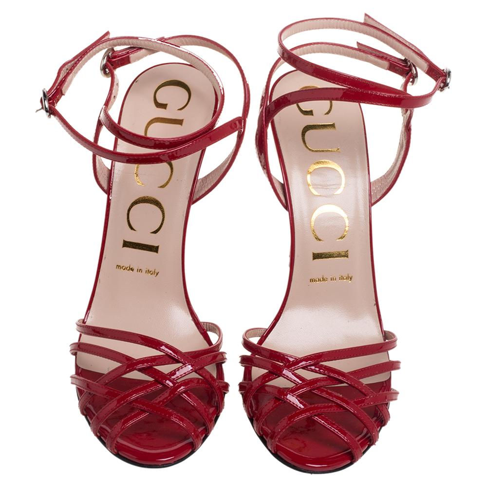 Go bold and glamorous in these stunning sandals from Gucci! Crafted from red patent leather, they feature a strappy silhouette with open toes. They flaunt ankle straps with buckle fastenings and come endowed with comfortable leather-lined insoles.