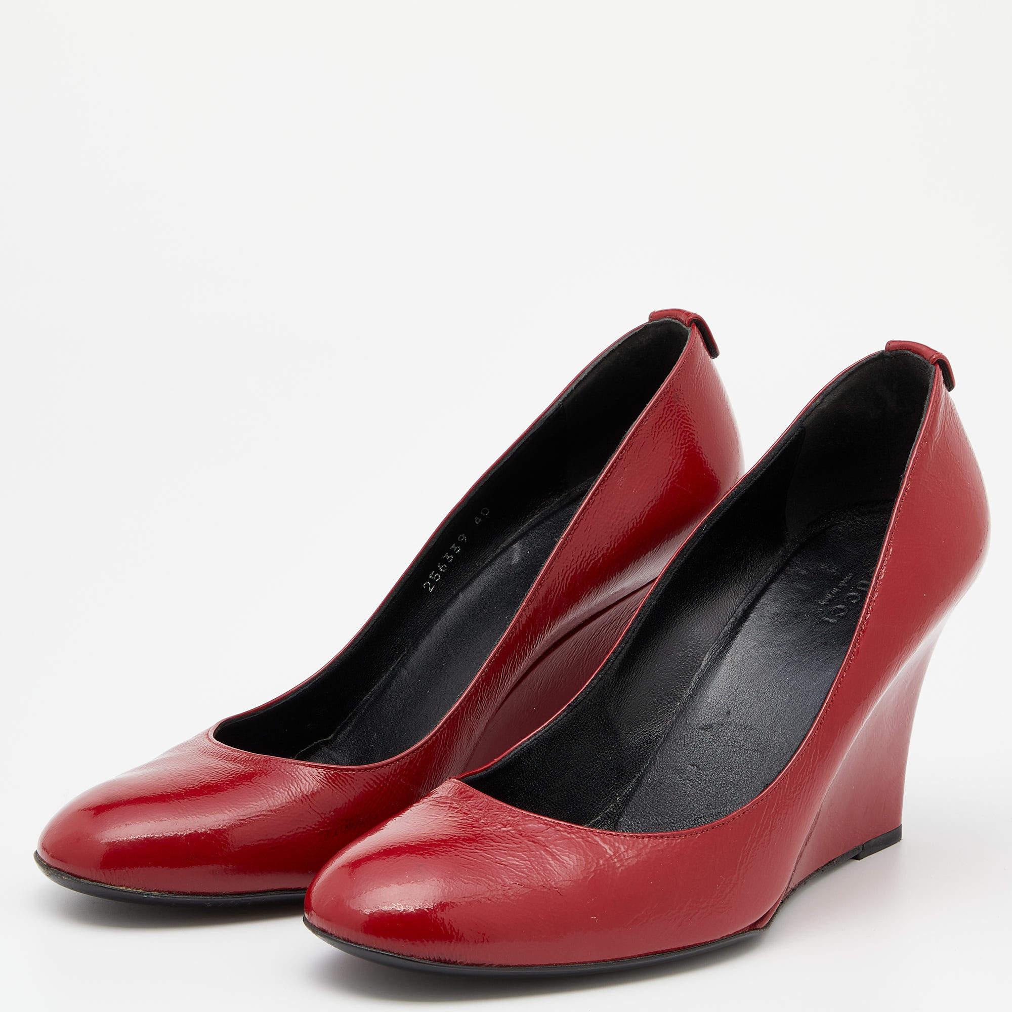 There are some shoes that stand the test of time and fashion cycles, these timeless Gucci pumps are the ones. Crafted from patent leather in a versatile red shade, they are designed with sleek cuts, round-toes, and wedge heels.

